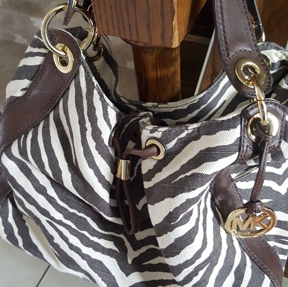 Michael Kors Handbags - Michael Kors animal print satchel purse